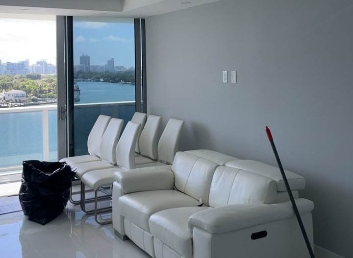Finished interior living space with floor-to-ceiling glass and a waterfront view.